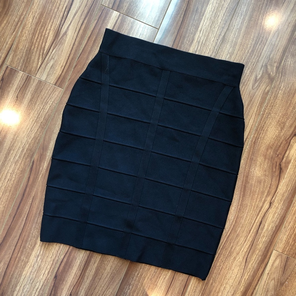 INC Black bondage skirt.